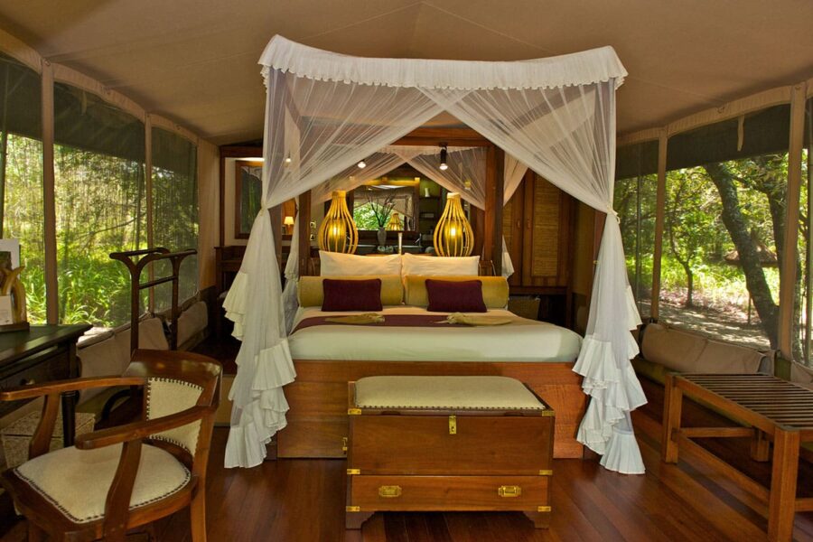 Four poster bed in a suite at Mara Intrepids Camp | Go2Africa