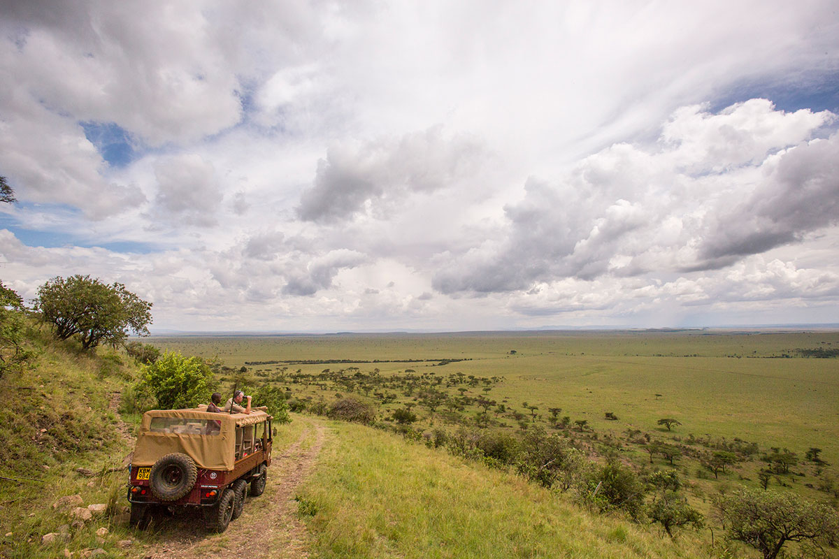 The expansive view of the Masai Mara from a safari vehicle in Kenya