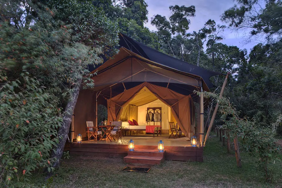 External view of the luxury safari tent at Elephant Pepper Camp in the Masai Mara, Kenya.