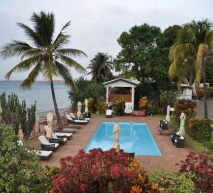 Allamanda Hotel swimming pool and beach view.