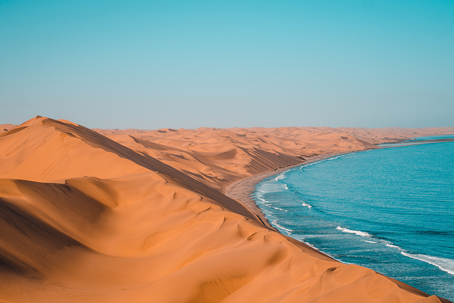 Dunes meet the coast in Namibia.