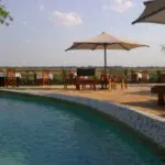 Take a refreshing dip in the swimming pool.