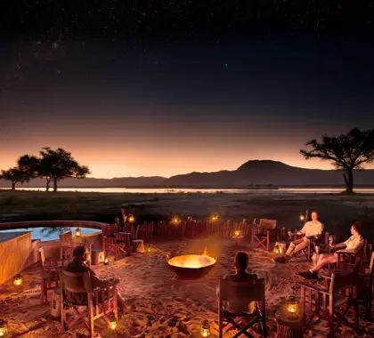 The boma, lit by lanterns and the stars. 