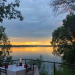 Dine on the scenic deck overlooking the Zambezi at Chundukwa.
