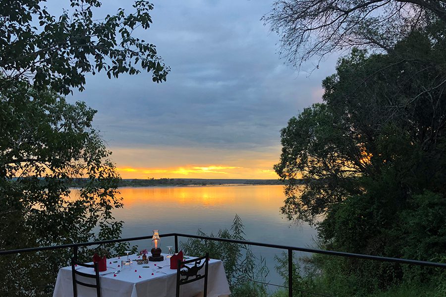 Dine on the scenic deck overlooking the Zambezi at Chundukwa.