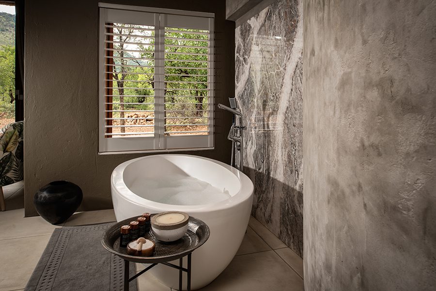 Bathrooms are en suite and feature large freestanding bathtubs.