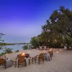 On the river beach, relax around the firepit. 