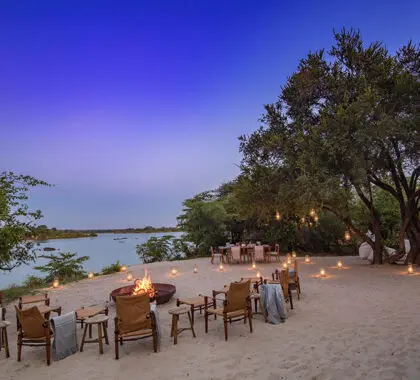 On the river beach, relax around the firepit. 