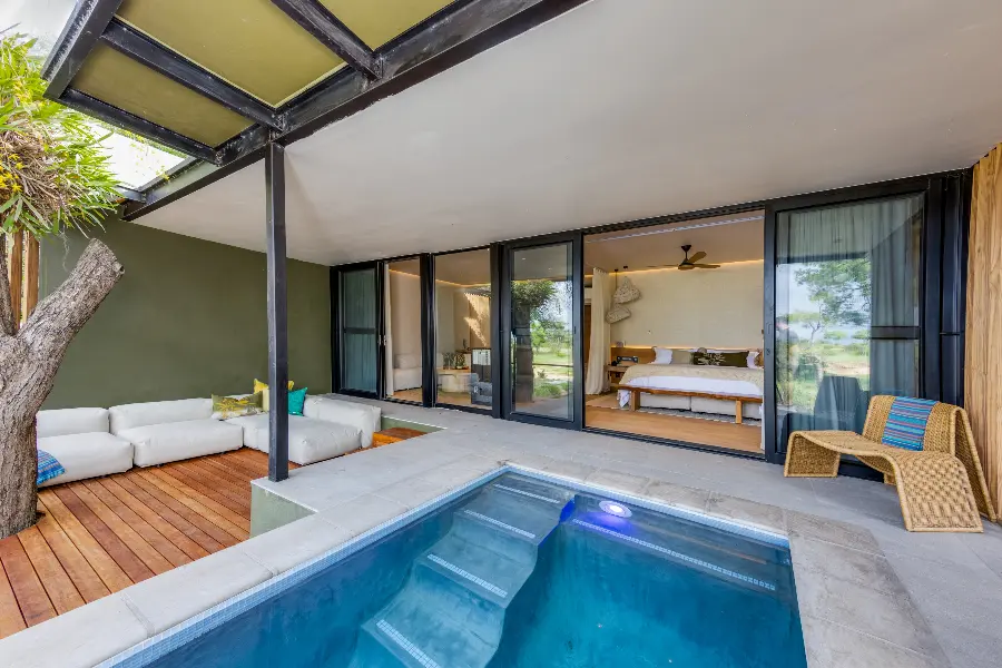 A private seating area, pool, and lovely bedroom | RockFig Safari Lodge