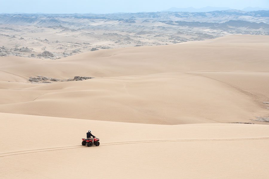 Quad biking on the sand dunes of Namibia.