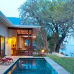 Baines' River Camp, set on the northern bank of the Zambezi River.