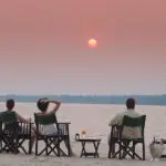 Enjoy spectacular views of the Zambezi River as the sun sets.