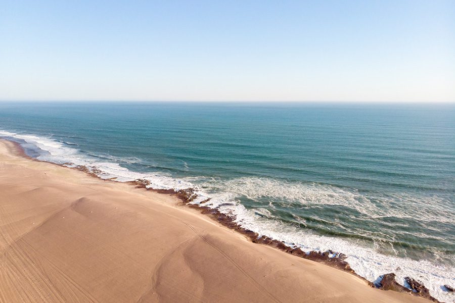 Where enormous dunes of the planet’s oldest desert meet the roaring Atlantic Ocean.