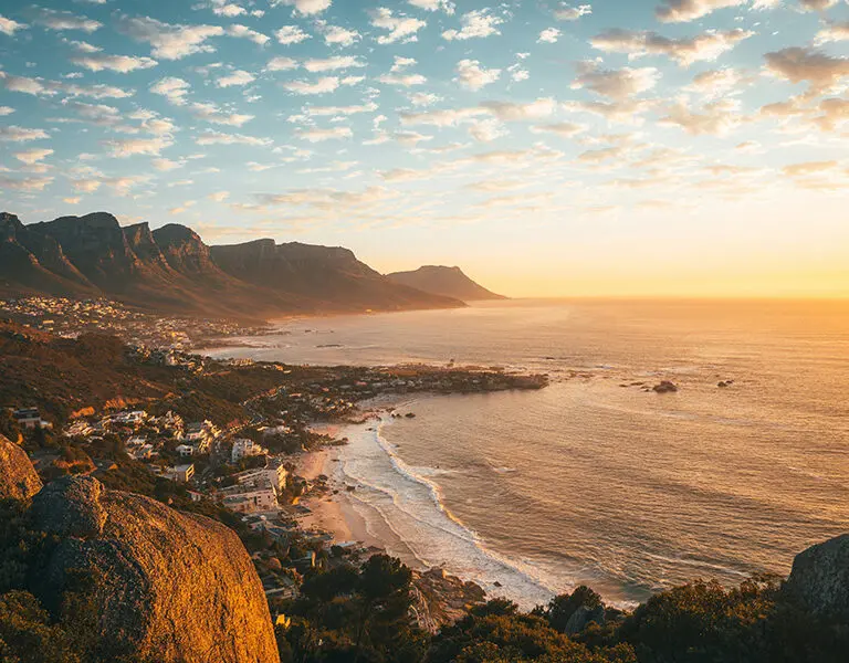 Cape Town mountains and ocean vistas at sunset.