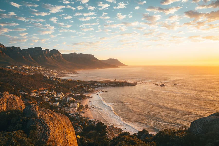 Cape Town mountains and ocean vistas at sunset.