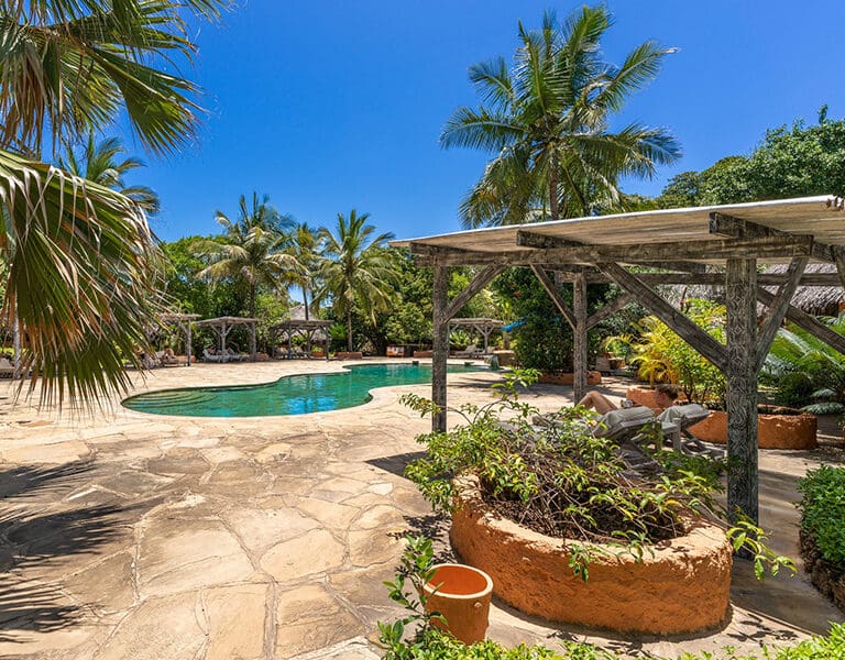 Relax in one of the pool cabanas.