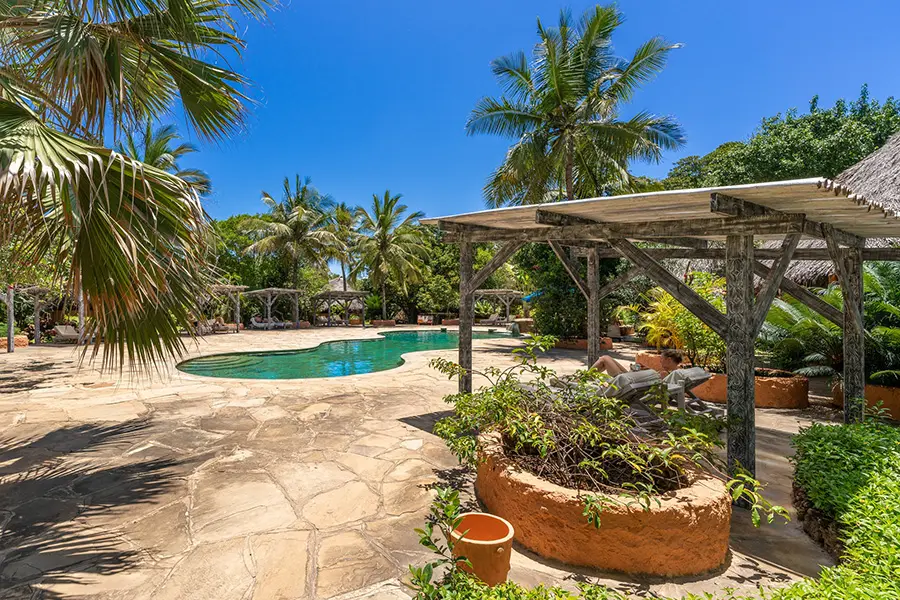 Relax in one of the pool cabanas.