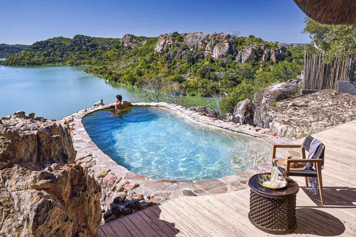 The swimming pool at Singita Pamushana Lodge, overlooks the Malilangwe Dam, in Zimbabwe.
