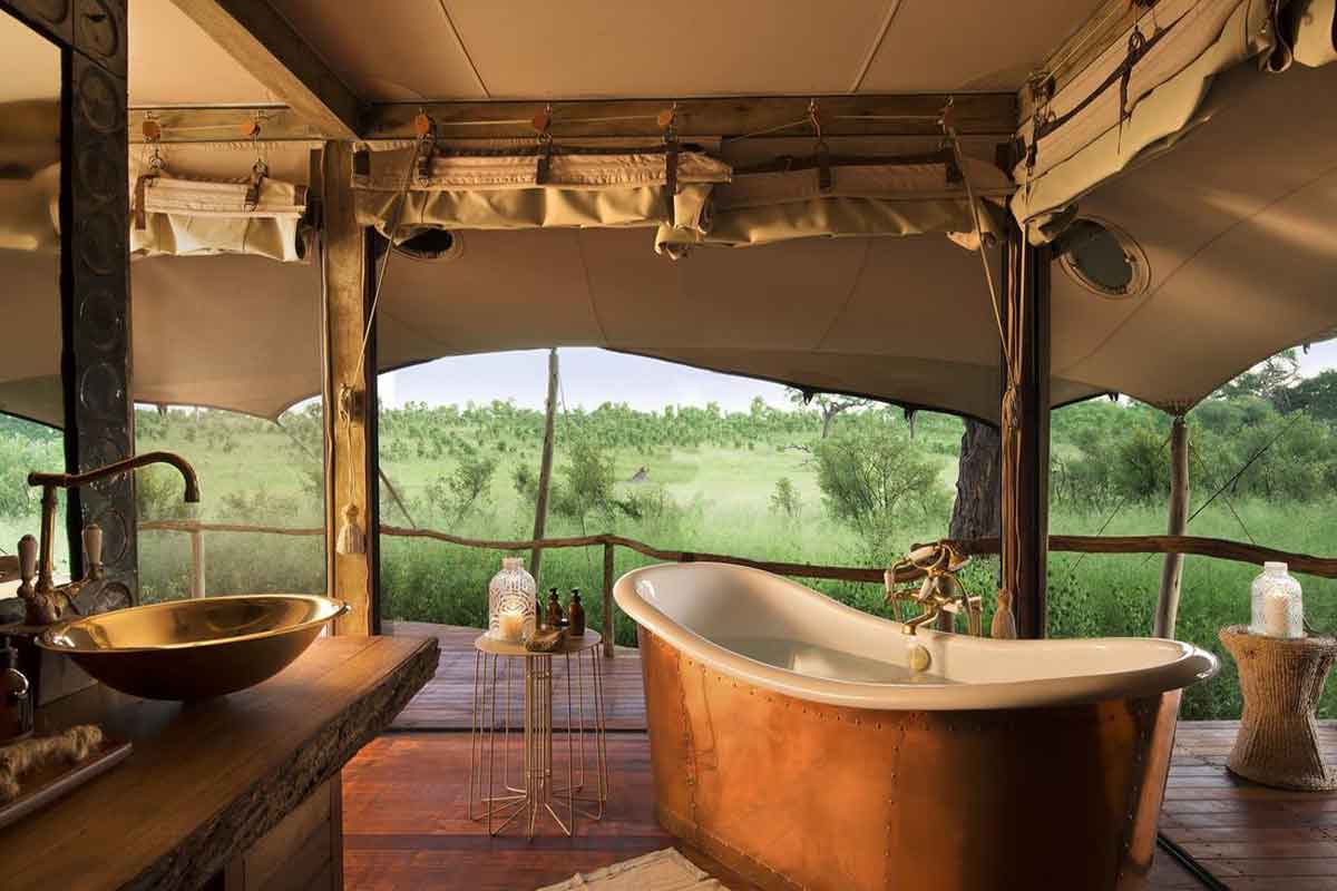 The en suite bathrooms at Somalisa Acacia in Hwange National Park have tubs encased in copper and stunning views.