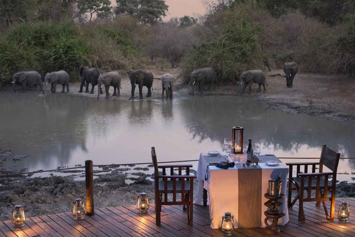 Dinner with a view of elephants at Kanga Camp, Mana Pools in northern Zimbabwe.
