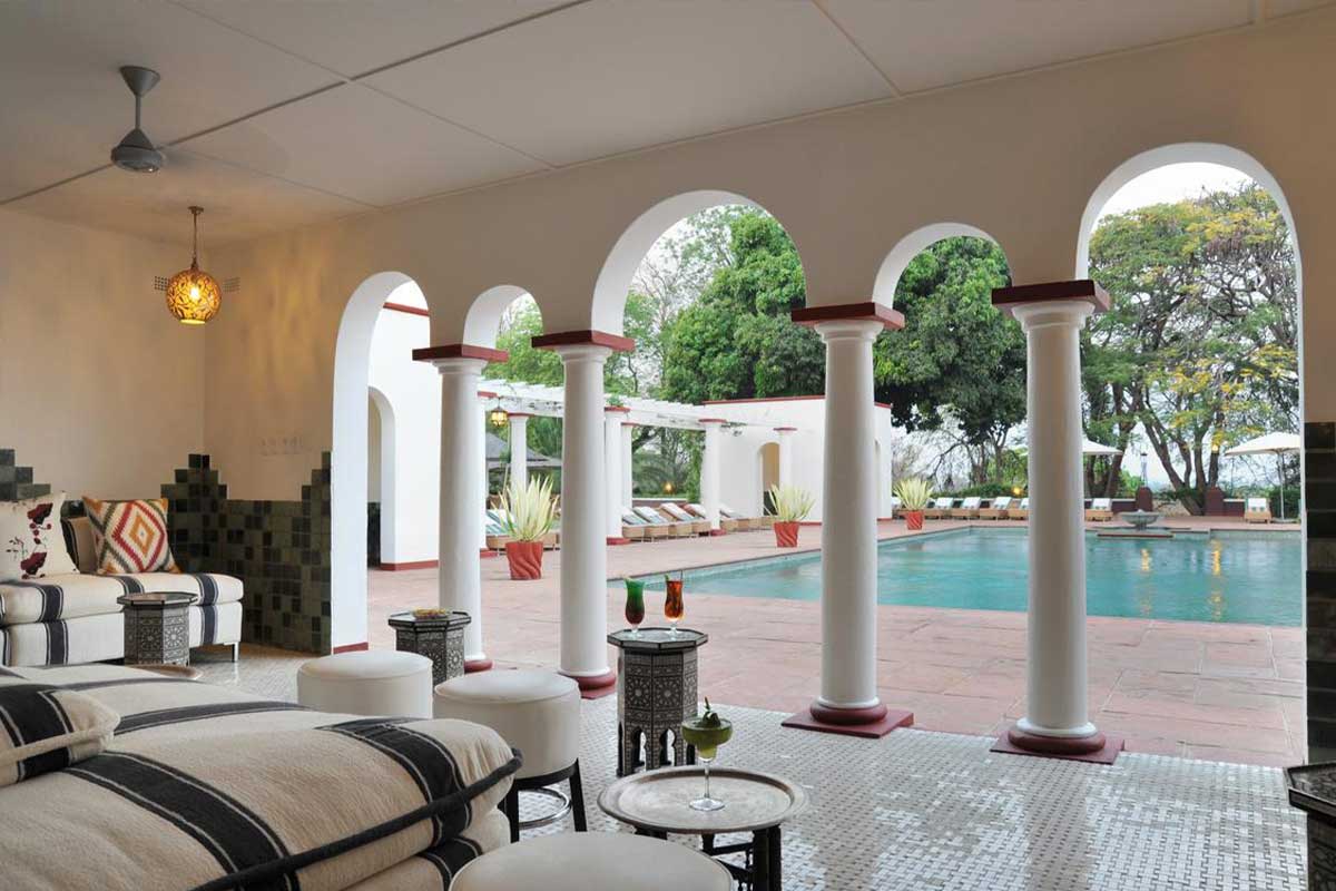 Victoria Falls Hotel's charming Edwardian-style pool lounge in Zimbabwe.