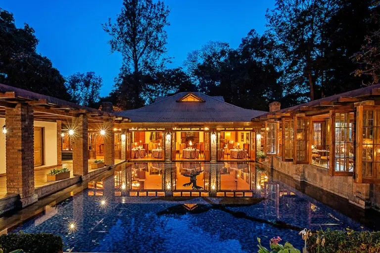 Spend evenings in luxury at Arusha Coffee Lodge.