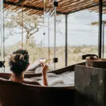 Soak in the bath, overlooking the reserve.