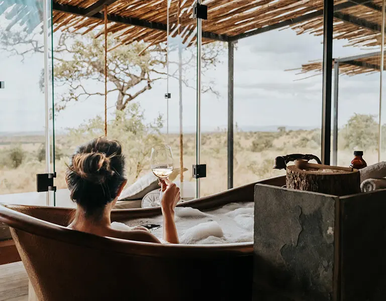 Soak in the bath, overlooking the reserve.