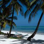 Uncompromising villas on a stretch of pristine white sandy beach.