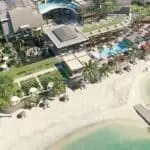 Amidst a plethora of lush greenery and crystal-clear ocean waters.