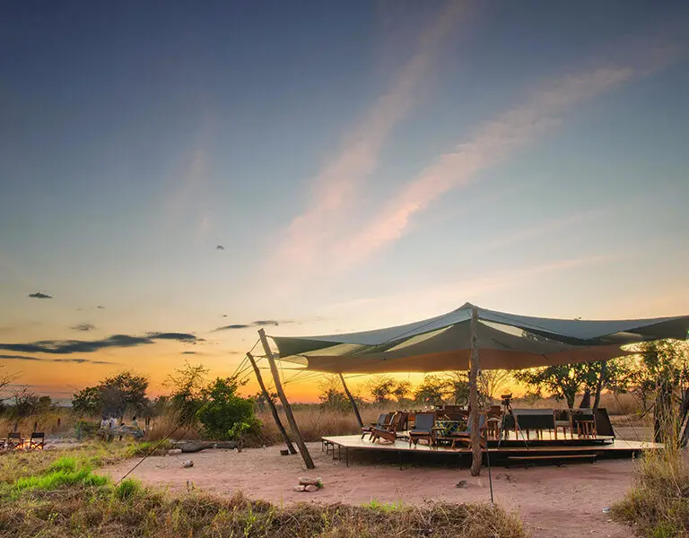 Sundowners in the main area at dusk | Usangu Expedition Camp