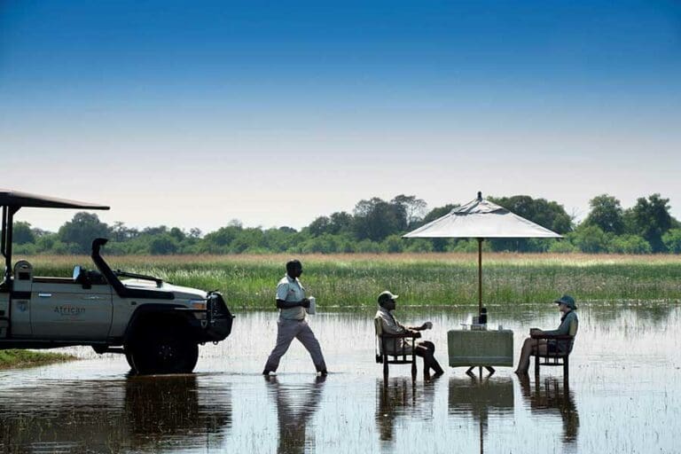 Enjoy sundowners on the Khwai River.