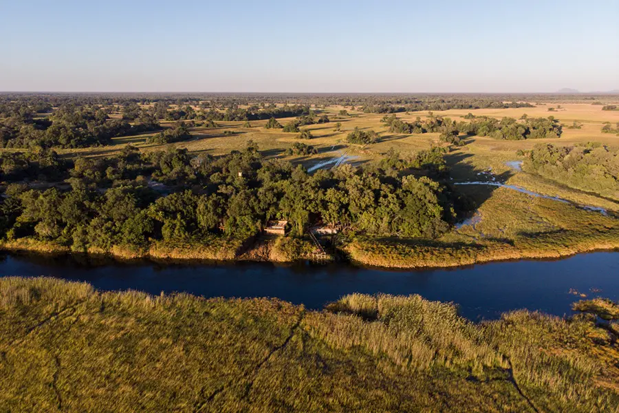 Nxamaseri Island Lodge is perched on the bank of a permanent water channel in the Okavango Delta.