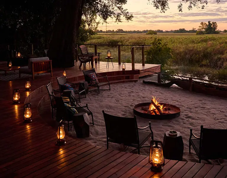 Enjoy a pre-dinner drink around the fire | Nxamaseri Island Lodge