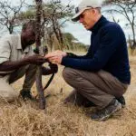 Setting up a camera trap with Usangu Expedition Camp.