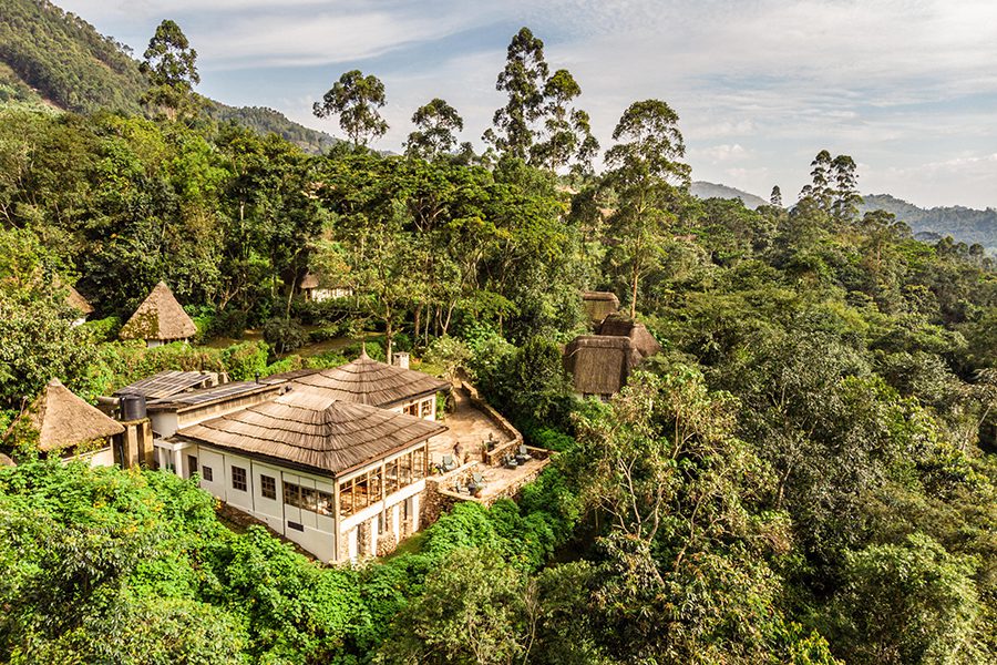 An aerial view of Bwindi Lodge, surrounded by a lush landscape. 