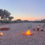 Enjoy sundowners on the dry riverbed near the Saruni Rhino Lodge in Kenya.