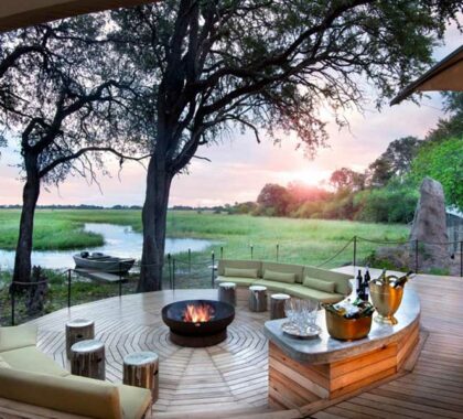 Sit by a crackling fire at Khwai Leadwood in the Moremi Game Reserve.