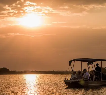 Sunset river cruise at Tongabezi Lodge.