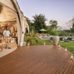 Main lounge, dining area and swimming pool.