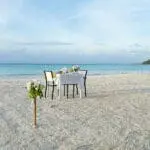 Request a romantic beach dinner.