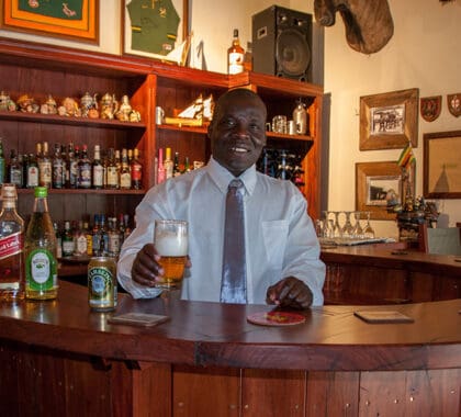 Barman welcomes you with a drink. 