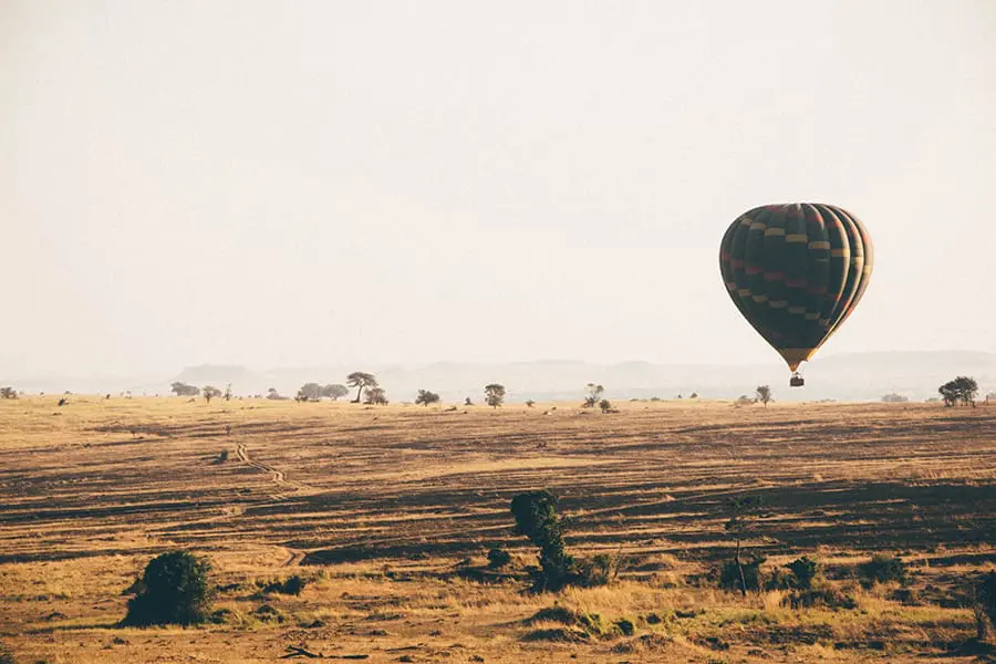 Hot air balloon floating above the Serengeti National Park in Tanzania.