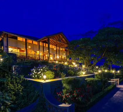 The lodge lounge and dining area lit up at dusk.