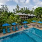 Spend the day lounging poolside at Acajou Beach Resort.