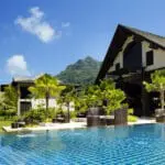 Tropical mountains behind you, luch palms surround you, and the beach stretches out in front of you. 