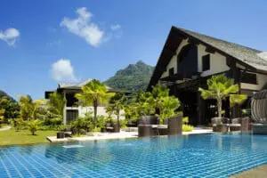 Tropical mountains behind you, luch palms surround you, and the beach stretches out in front of you. 