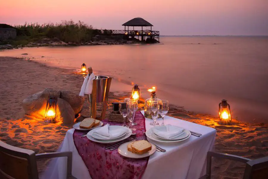 A romantic sunset beach dinner.