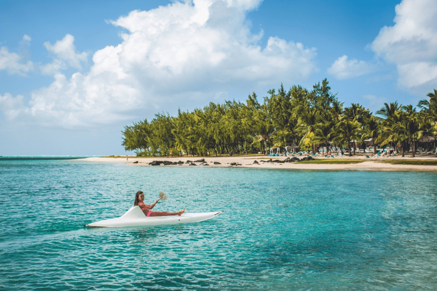 A girl enjoying a paddle from Shandrani Beachcomber Resort & Spa | Go2Africa