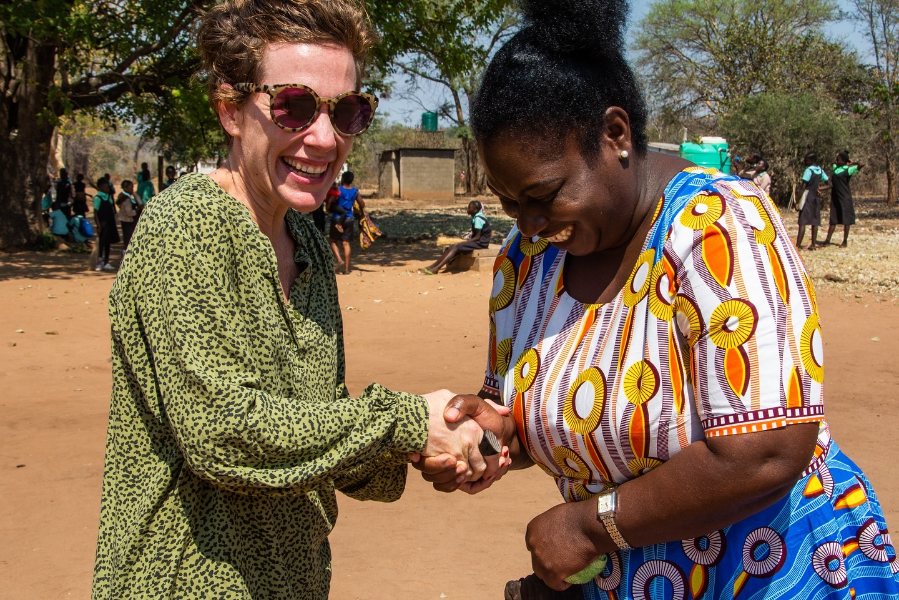 Two women shaking hands | Go2Africa